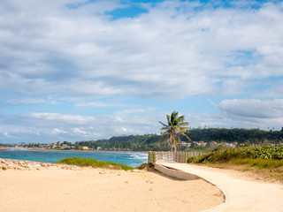 Wooden dock on Jobos beach, a beautiful beach on the west coast of Puerto Rico, USA.