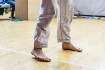 Close up on Brazilian Jiu Jitsu BJJ Judo fighter feet at the tournament waiting for the fight