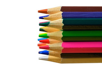 Fototapeta premium Textured wood colored pencils. Colored pencils macro. Assortment of colored wood drawing pencils on white background. Copy space