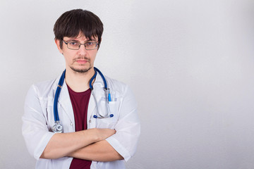 male doctor standing with stethoscope, medicine concept