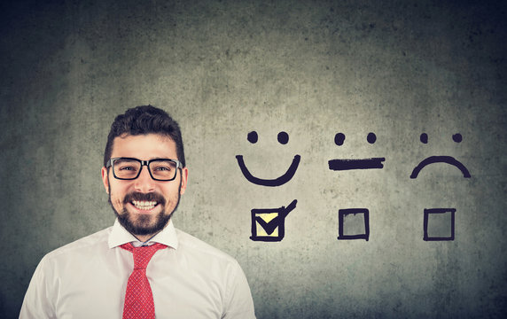 Confident happy business man received excellent rating for a satisfaction survey