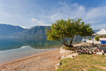 Morning beach with sea and mountain