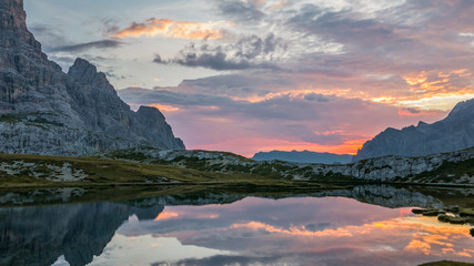 Surrealistic landscape of peaceful mountain lake at sunrise