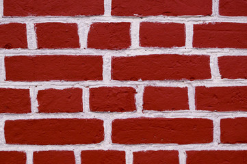 wall of red bricks with white paint texture, background. exterior