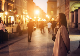 Beautiful girl in the evening on the street