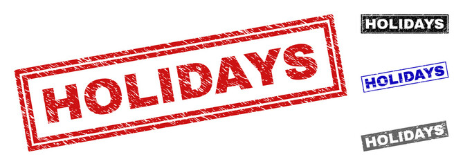 Grunge HOLIDAYS rectangle stamp seals isolated on a white background. Rectangular seals with distress texture in red, blue, black and gray colors.