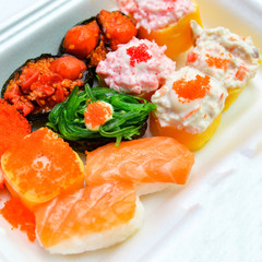 Set box sushi rolls rice and sashimi with salmon tuna royal prawn cheese cream salad