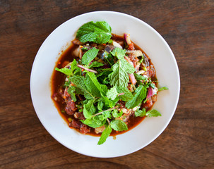 Spicy minced beef salad raw meat beef slice mixed with spices and herbs