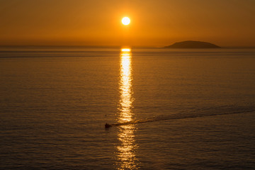 Fototapeta premium fishing boat returning from work
