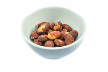 Almonds nut seeds bake salt in bowl isolated on white background