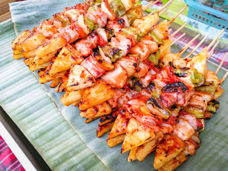 BBQ roasted pork meat and vegetable fruit with sauce skewer sticks
