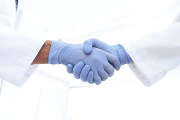 hand in the medical glove (handshake)