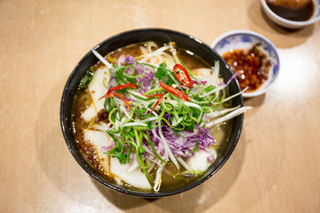 Pho Vietnamese seafood soup in the bowl