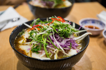 Pho Vietnamese seafood soup in the bowl