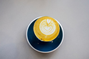 Turmeric latte in the cup