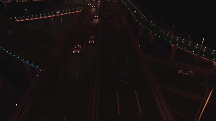 Aerial top view of highway interchange on the sunset. Aerial top view of road junction from above, automobile traffic and jam of many cars, useful for engineering, industrial, transportation concept