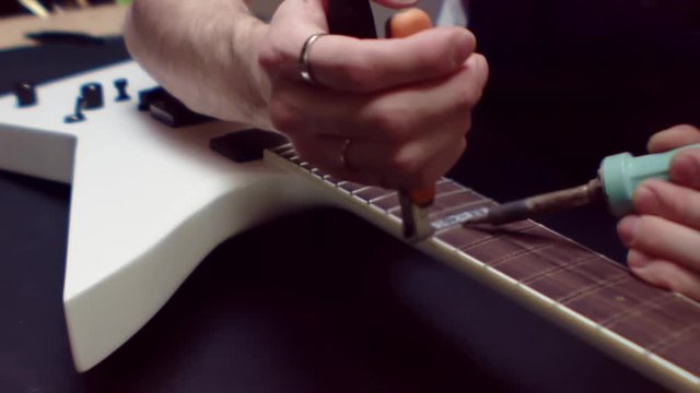 Guitar fretboard fixing with tool