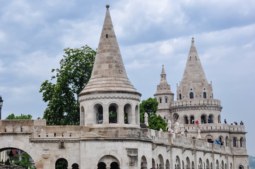 Fototapeta na wymiar Public Park. Budapest- Fisherman's Bastion is a neo-Gothic and neo-Romanesque style structure situated on the Castle hill in Budapest. Shot on a rainy day.