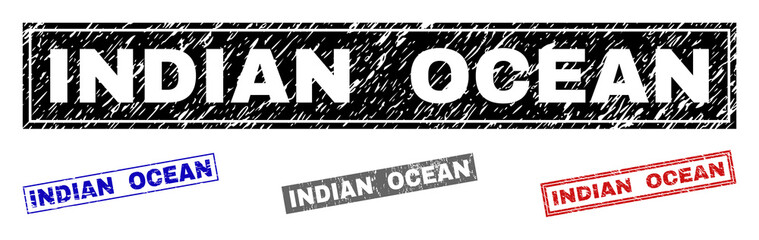 Obraz premium Grunge INDIAN OCEAN rectangle stamp seals isolated on a white background. Rectangular seals with grunge texture in red, blue, black and grey colors.