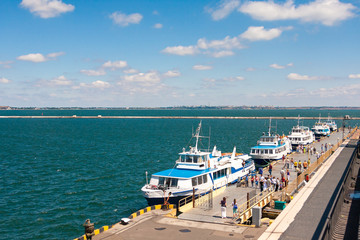 Few boats at sea port waiting for passenger. Summer vacations.