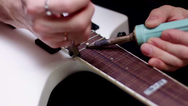 Fixing an electric guitar fretboard