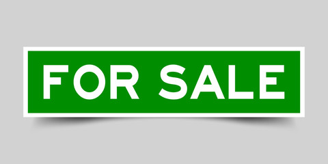 Green color sticker in word for sale on gray background