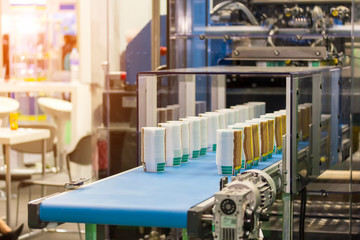 Many row of paper cup on automatic conveyor belt during manufacturing process in factory