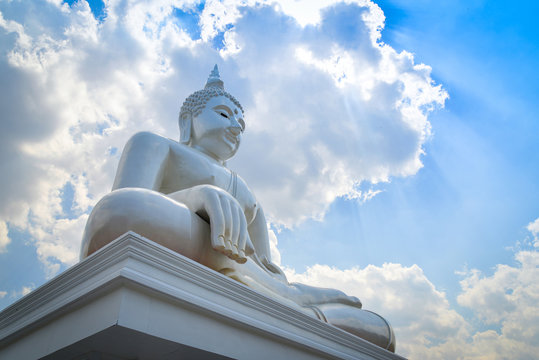 Beautiful white buddha statue on nature cloud sky background