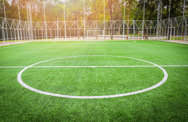 Football field - Futsal field green grass sport outdoors white line circle center and goal nets