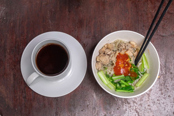 healthy organic chicken noodles with vegetables and a cup of tea