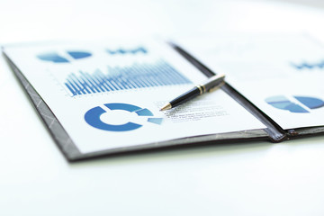 background image of a clipboard with financial report on table