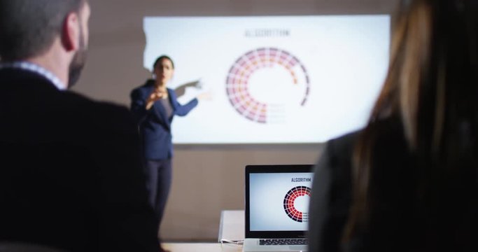 4K Confident young businesswoman presenting marketing data analysis in a meeting. Slow motion.
