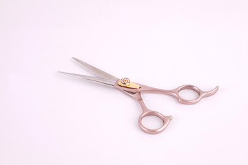 Top view professional scissors for haircuts isolated on white background