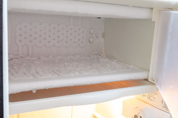 Interior walls of manual defrost refrigerator/fridge freezer with ice build up