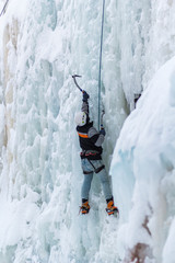 Man Ice Climbing