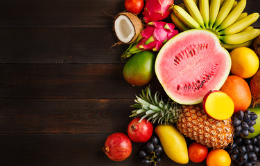 Exotic fruit on a wooden background with copy space.
