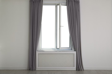New modern window with curtains in room
