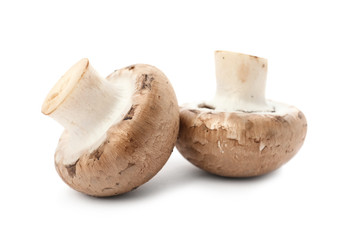Fresh raw champignon mushrooms on white background