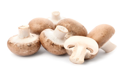 Fresh raw champignon mushrooms on white background