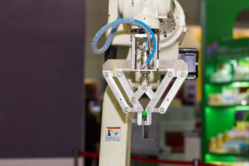 high technology and precision robot arm with grip for catch product  in manufacturing process