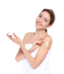 Young woman with jar of cream on white background. Beauty and body care