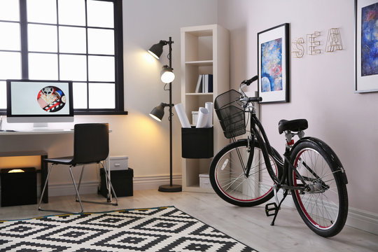 Stylish room interior with modern bicycle. Hipster design