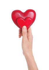 Woman holding decorative hearts in hand on white background, closeup