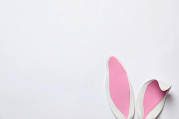 Funny Easter bunny ears on white background, top view