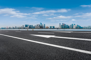 Foreground highway asphalt pavement city building commercial building office building