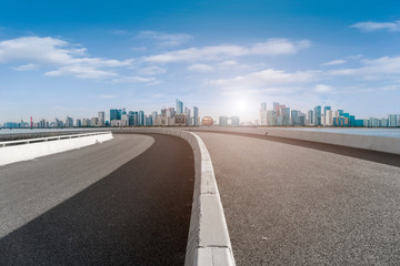 Foreground highway asphalt pavement city building commercial building office building