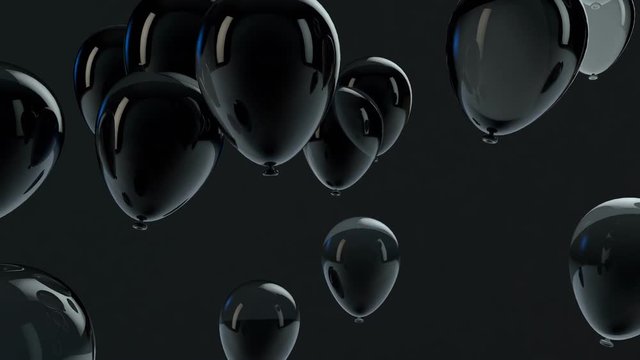 Black balloon floating in the air