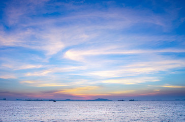 Blue sky background with white clouds over islands in the sea or lake At sunrise or sunset