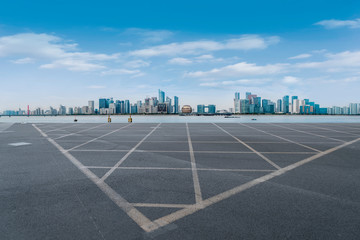 Foreground highway asphalt pavement city building commercial building office building