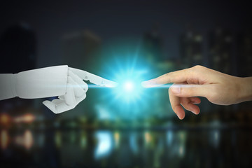 Robot and human hands touching on city background, Artificial Intelligence Technology Concept.
